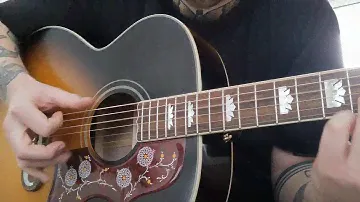 Epiphone Inspired by Gibson J-200 sunburst.